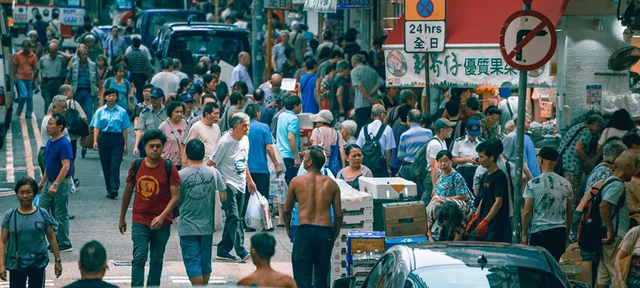 man walking in a busy road image - how to stop caring what other people think_ blog